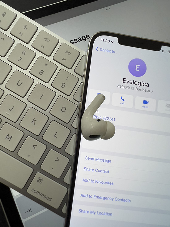 Image of phone, email, keyboard, and AirPod